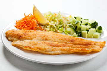 Fried fish fillet with vegetables
