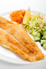 Fried fish fillet with vegetables