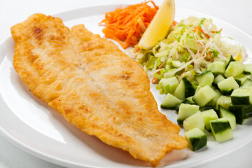 Fried fish fillet with vegetables