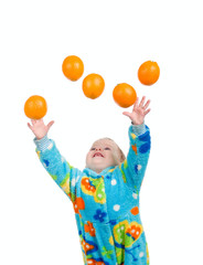 Fototapeta na wymiar Little baby girl caughts orange