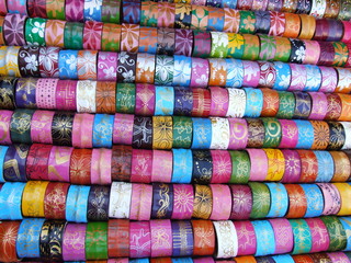 Colored bracelets for sale at a market in Bangkok, Thailand.