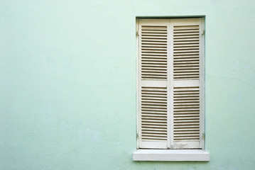 Fototapeta na wymiar White, closed window shutters