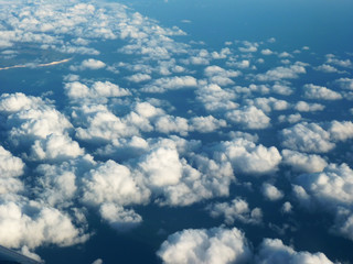 Naklejka na ściany i meble clouds into the blue sky - above view