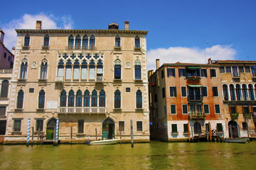 Fototapeta na wymiar Two Buildings in Venice by Canal
