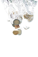 Euro coins falling into the clear water