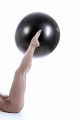 womans legs with pilate ball