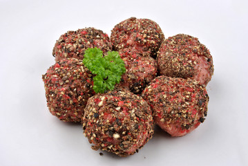 peppered minced meat balls on a plate