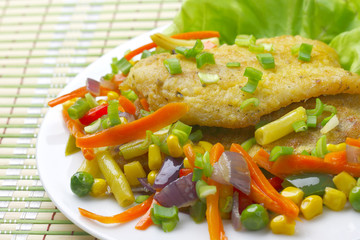 Fried fish fillet with vegetables.