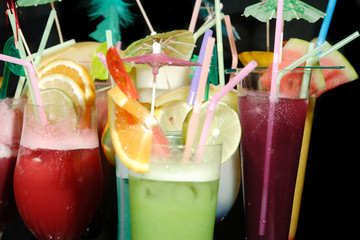 Various cocktails on black background