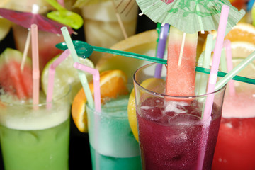 Various cocktails on black background