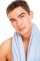 Portrait of young man with towel on neck