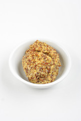 some organic mustard in a white bowl