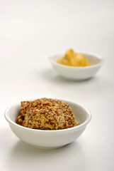 some organic mustard in a white bowl