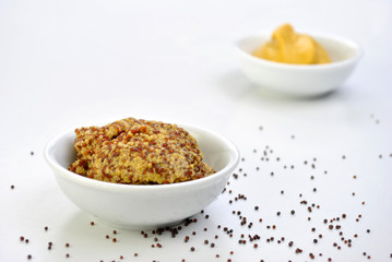 some organic mustard in a white bowl