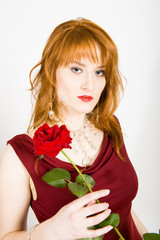 Glamour portrait of sexy  woman with red rose on valentines day