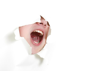 young man shouting loudly through hole in paper
