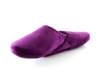 Pair of purple slippers over white background