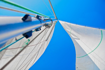 white sail over blue sky