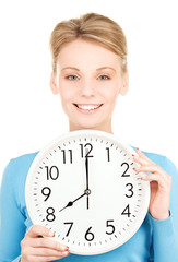 woman holding big clock