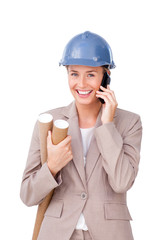 Self-assured female architect on phone standing
