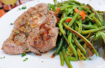 porterhouse juicy steak with fresh green beans