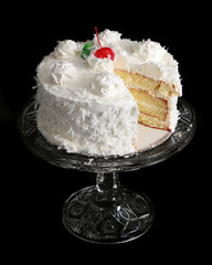 Coconut cake on an antique cake plate - 19533121
