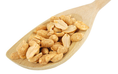 mixing spoon with dry roasted peanuts on white