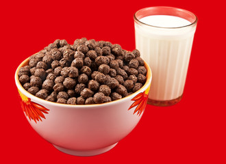 Milk and chokolate balls on the red