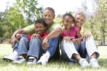 Fototapeta premium Grandparents In Park With Grandchildren