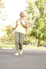 Senior Woman Jogging In Park