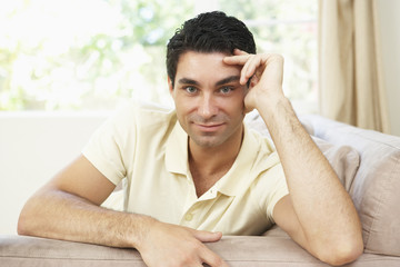 Fototapeta premium Man Relaxing On Sofa At Home
