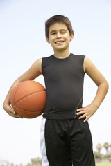 Young Boy Playing Basketball