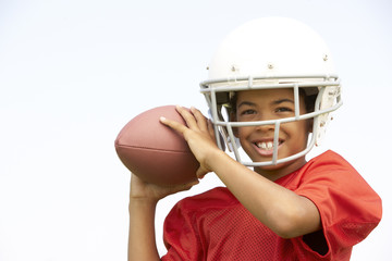 Young Boy Playing American Football