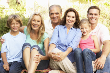 Fototapeta premium Extended Group Portrait Of Family In Garden