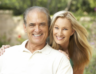 Senior Man Hugging Adult Daughter