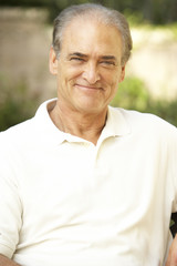 Smiling Senior Man In Garden