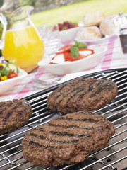 Burgers Cooking On Barbeque Grill