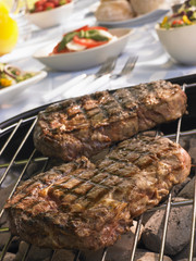 Steak Cooking On A Grill