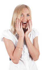 The cheerful charming blonde in a white shirt