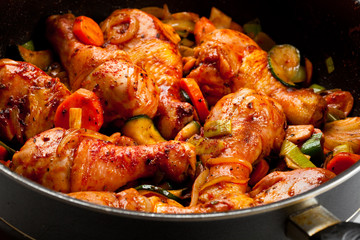 Roasted chicken drumsticks and vegetables