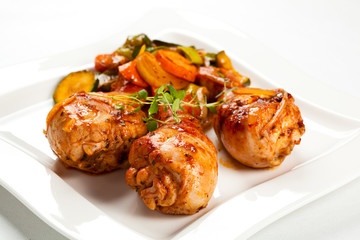 Roasted chicken drumsticks and vegetables