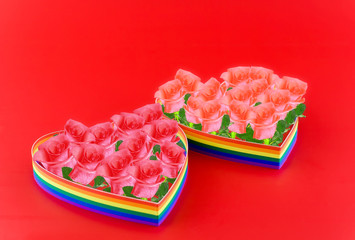St. Valentine Day.Two hearts, paint of a six-colour gay flag