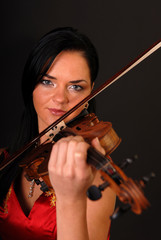 Young beautiful woman with violin