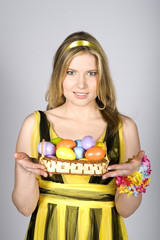 Young pretty spring woman with easter eggs
