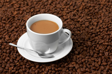 Cup with coffee, costing on coffee grain