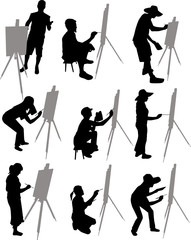 artist paints at easel