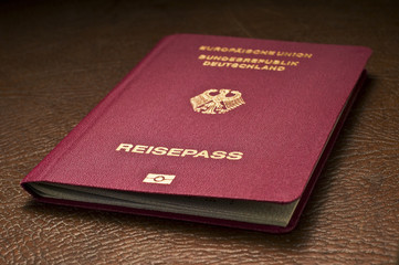 german passport on leather baggage