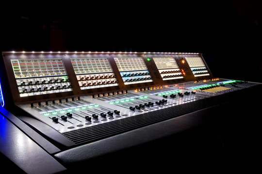 professional audio mixer in a recording studio