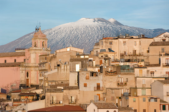 view of village and belltower on background Etna