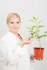 Young  female scientist of botany with green plant